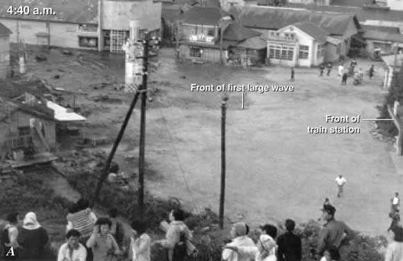 photo of people watching flooding